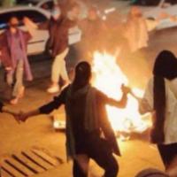 Iranian women without hijabs dance around a bonfire in Bandar Abbas, Hormozgan province, September 22, 2022.