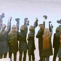 Iranian girls remove hijab in honor of murdered Mahsa Amini, September 2022.