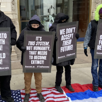 Chicago Revolution Club with signs