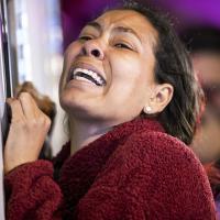 Woman distraught at Mexico detention center fire kills dozens, March 27, 2023.