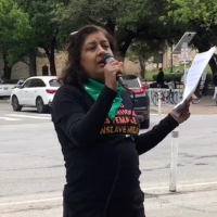 Coco Das speaking at Austin protest, April 8.