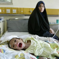 Child being treated for diarrhea in Baghdad, Iraq, 2004.