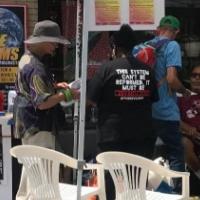 People congregating at a street fundraising event