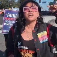 Young woman revcom counter-protesting anti-gay protest