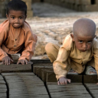 Two very young child laborers in a brick factory