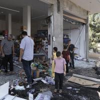 Palestinians look at the damage after an Israeli army raid on Jenin, West Bank, Friday, Nov. 3, 2023.