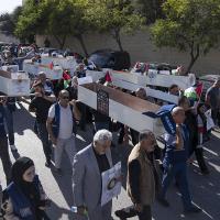  Palestinian journalists carry mock coffins of Palestinian journalists who were killed during the current war in Gaza.