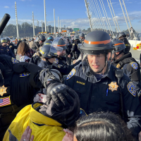 Cops trying to clear demonstrators who shut down the San Francisco-Oakland Bay Bridge protesting Israel’s war on Gaza, in conjunction with the APEC Summit, November 16, 2023.