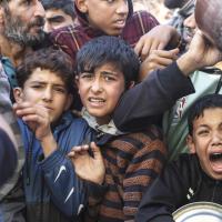Gaza Strip:  children line up for food in Rafa, November 30, 2023.