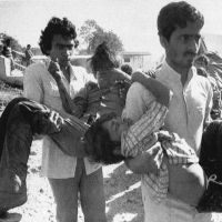Children blinded by the poison gas leak at the Union Carbide plant in Bhopal, India, being carried to a hospital.