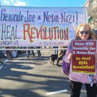 Revcoms with banner and poster at March on Washington for Gaza, January 13, 2024.