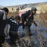 Migrants cross the Rio Grande to reach the United States from Ciudad Juarez, Mexico