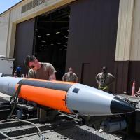 USAF squadron loads an unarmed B61-12 bomb, which can be outfitted with a nuclear warhead, on a B-2 Spirit bomber.