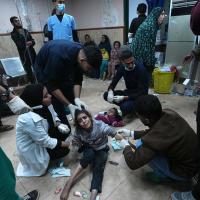 Palestinians wounded in Israeli bombardment of the Gaza Strip are brought to Al Aqsa hospital in Gaza Strip, February 22, 2024.