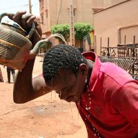 In the African country of Mali, one city reached 119 degrees, which may be the highest temperature ever recorded in Africa. This level of heat is deadly. People's liver and kidneys fail, and their brains swell. Here a welder, cools off with water in Bamako, Mali, April, 18, 2024. 