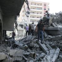 Palestinians search rubble from the Israeli bombing in Nuseirat refugee camp, Gaza Strip, June 8, 2024.