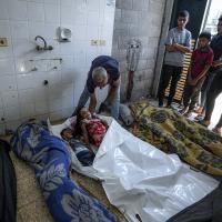 Checking bodies from Israeli bombardment of Gaza Strip at a hospital morgue in Deir al-Balah, July 13, 2024