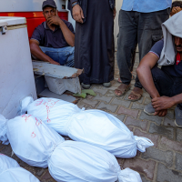 Palestinians at a hospital in central Gaza mourn relatives killed in Israeli bombardment, July 18, 2024.