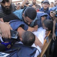 Colleagues bid farewell to Ismail Ghoul and Rami Al-Rifi after they were targeted directly while returning from coverage from Gaza City.