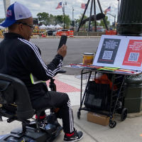 People at the Detroit Ribs R&B festival subscribing to @BobAvakianOfficial on the spot, August 10, 2024.