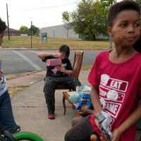 In Springfield, Ohio, Haitian kids who are kept home from school because of the bomb threats at their schools sell Kool-Aid, September 17, 2024.