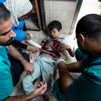 Doctors at Deir al-Balah treat a child wounded in the Israeli bombardment of the Gaza Strip, September 29, 2024.