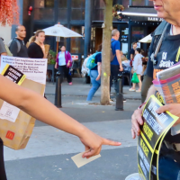 Woman interested in poster “No Election Can Legitimize Fascism”