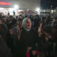 Palestinians react to the announcement of a ceasefire between Hamas and Israel in Deir al-Balah, central Gaza Strip, January 15, 2025.