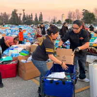 The grassroots donation center at Santa Anita Park grew overnight to thousands of people bringing donations and volunteering to help.