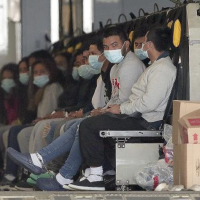Migrants, shackled, sit on a military aircraft at Fort Bliss in El Paso, Texas, January 30, 2025.
