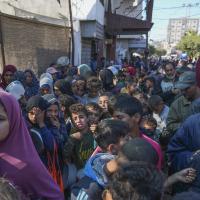 Palestinians queue for food in Deir al-Balah, Gaza Strip, November 18, 2024.
