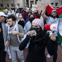 Palestinian supporters, (Mahmoud Khalil, second from left) protest genocide in Gaza at Columbia University, October 12, 2023.