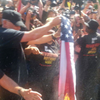 Joey Johnson burning flag iat the Republican National Convention, Cleveland, July 20, 2016.