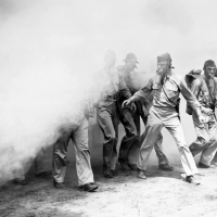 U.S. troops in Panama participate in a chemical warfare training exercise with smoke during World War II.