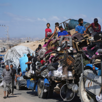 Displaced Palestinians flee along coastal road toward southern Gaza with no place to go, September 9, 2025.