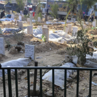 Graves of people killed in Israeli bombardments inside Shifa Hospital grounds, December 31, 2023.