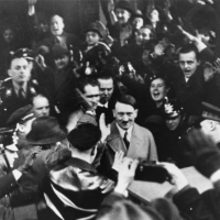 Germans cheer Adolf Hitler as he leaves the Hotel Kaiserhof just after being sworn in as chancellor. Berlin, Germany, January 30, 1933.
