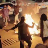 Iranian women dance around bonfire Bandar Abbas iran