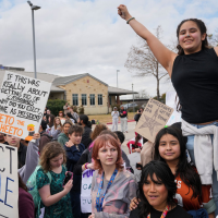 Students protest ICE outside the Pflugerville, Texas Justice Center after walking out of their classes, February 2, 2026.