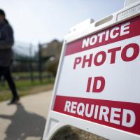 Photo ID Required sign in front of North Carolina voting location, March 5, 2024.