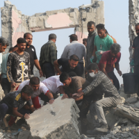 Rescuers search through rubble after the US-Israeli strike on a girls’ elementary school in Minab, Iran, February 28, 2026.