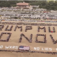 Thousands of protesters gathered at Ocean Beach in San Francisco on No Kings Day, March 28, 2026, to spell out TRUMP MUST GO NOW!