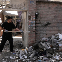 Residential building hit by a U.S.-Israeli strike in Tehran, March 27, 2026.