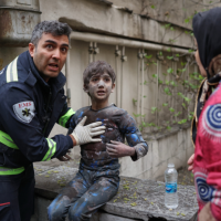 An injured boy after a strike that hit a residential building, Tehran, Iran, March 28, 2026.