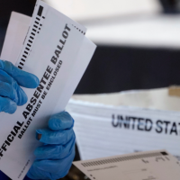 Fulton Co., GA election worker processes absentee ballots, November 2, 2020